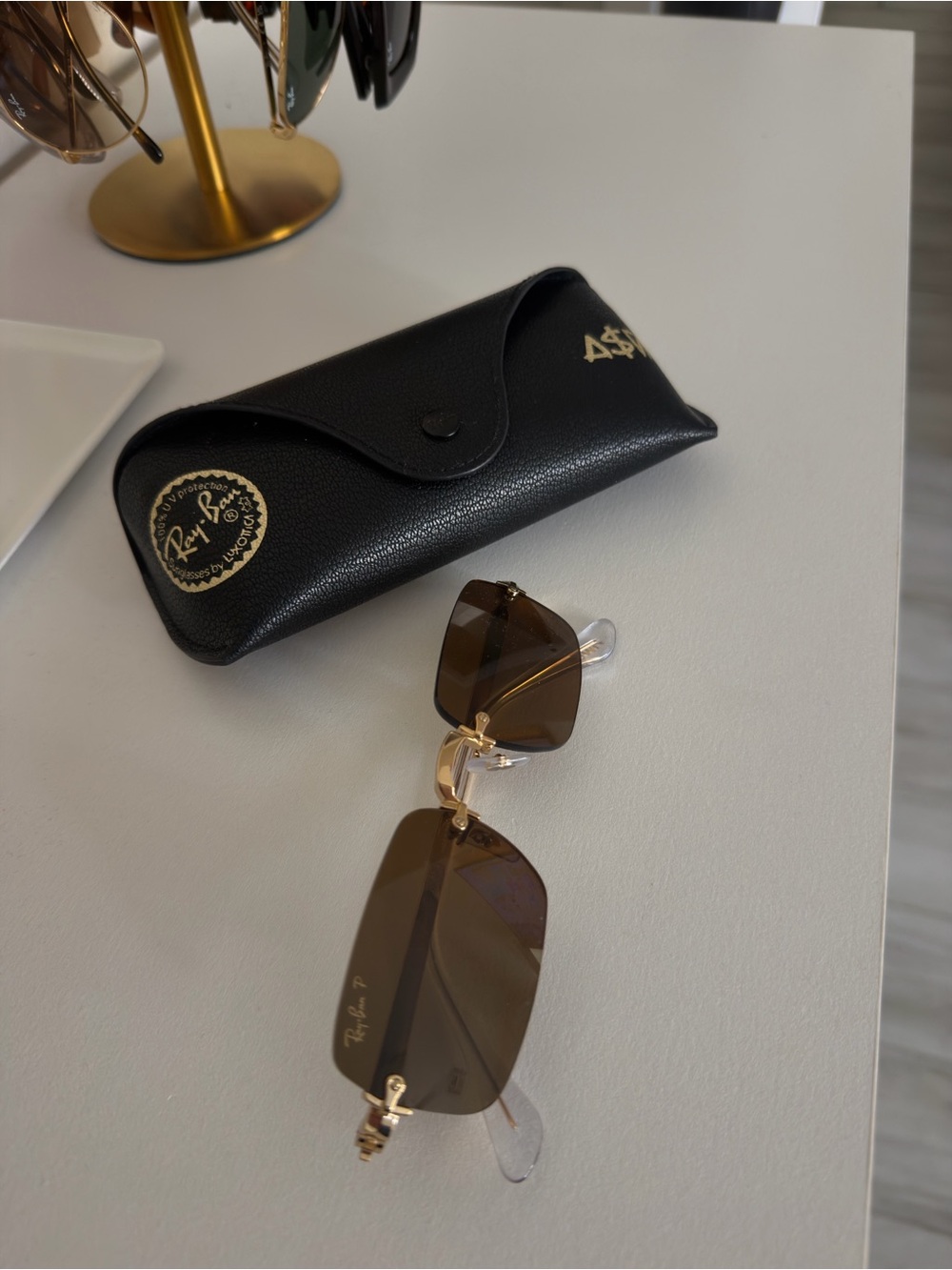 Ray-Ban Women Rimless Sunglasses with Brown Lenses and Gold Accents
